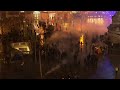 Riot police use tear gas against yellow vest protests in Paris