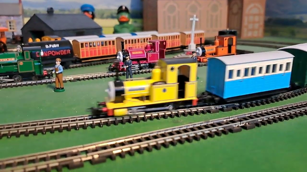 Bachmann Yellow Rheneas Pulling green and 1 blue coaches - YouTube