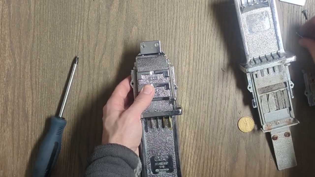 Coin operated laundry machine. Coin slide spare part replacement