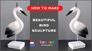 Beautiful DIY bird sculpture. White cement crafts