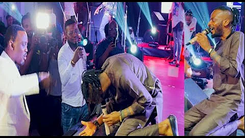 This is beautiful! 9ice gets down on his knees and bows to congratulate Pasuma on his birthday.