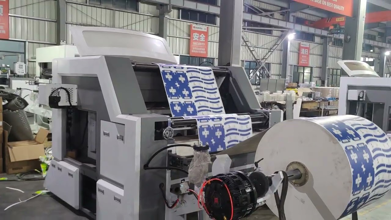 ROLL PUNCHING MACHINE FOR COFFEE CUPS