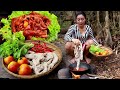 Cooking Pig intestines spicy chili curry with tomato in the forest taste delicious