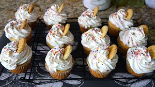 Moist Vanilla Cupcakes Topped With Vanilla Buttercream Frosting