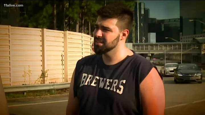 Dramatic video shows moment police officers pull passenger from burning car