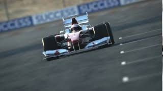Formula One race car on desert circuit footage 2652581