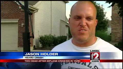 Biplane crashes in yards killing pilot, passen