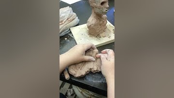 Sculpting a nose in clay