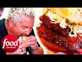 Guy fieri bites into a meatfilled short rib sandwich bomb  diners driveins and drives