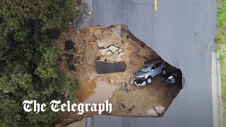 video: Watch: Giant sinkhole swallows cars in California during deadly US storms