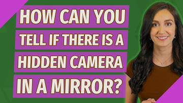 How can you tell if there is a hidden camera in a mirror?