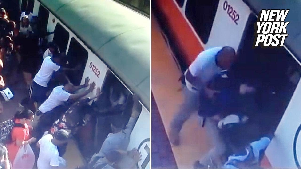 ny post mets Commuters rescue woman whose leg got stuck exiting a train