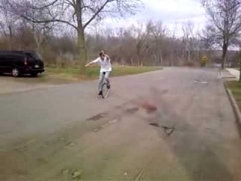 Flying a kite while riding a unicycle