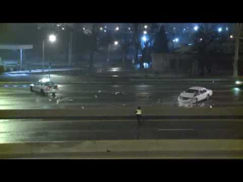 Inattentive driver crashes into police car responding to an accident