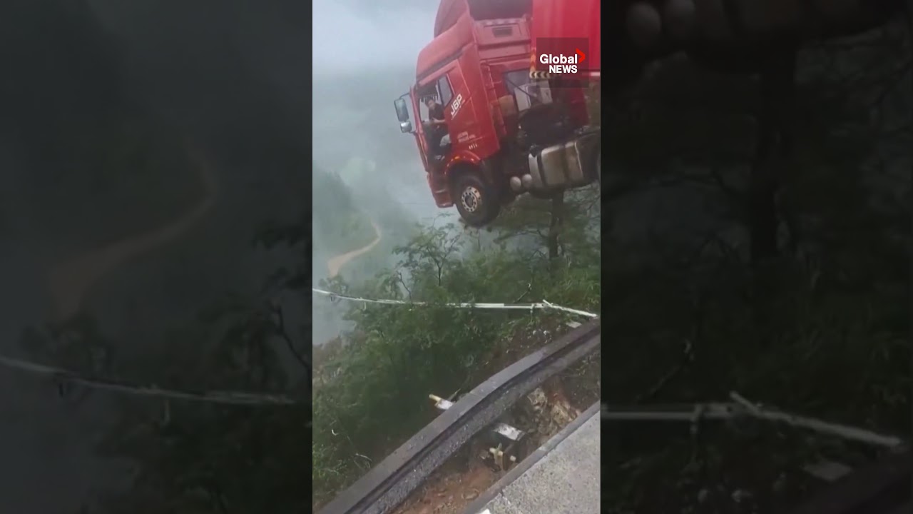 Truck dangles precariously over edge of collapsed bridge in China