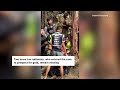 Four Laos villagers emerge from a flooded Laos cave