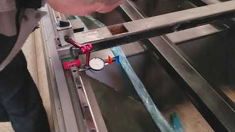 Dial indicator measuring guide rail parallelism