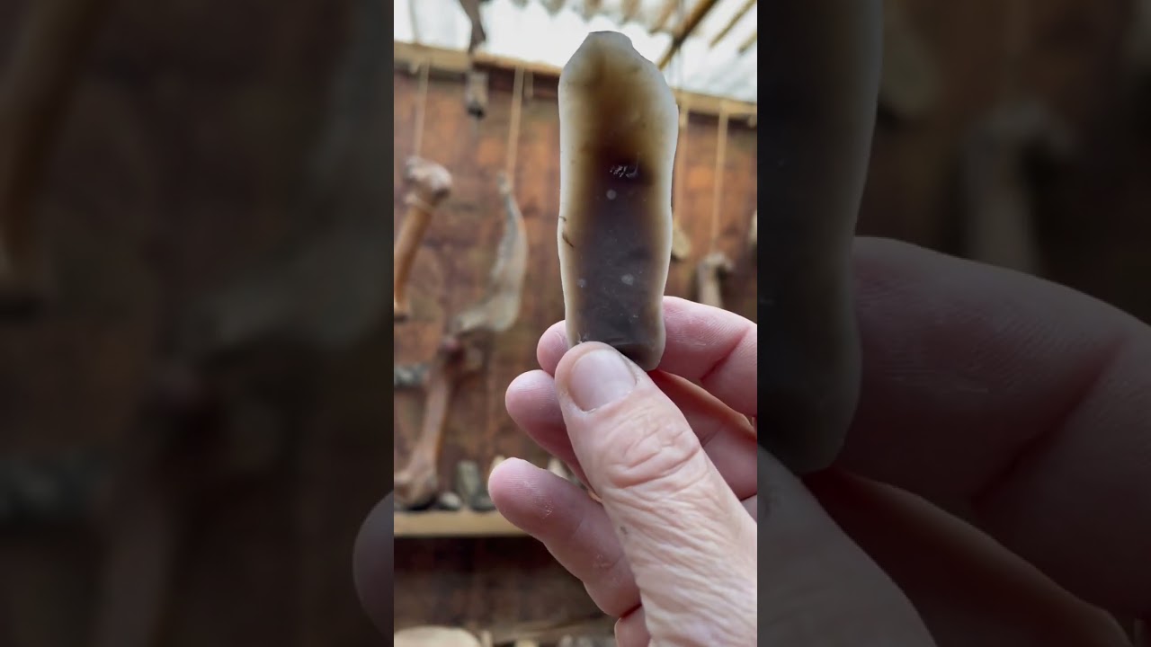 Flint blade core reduction using a hammer stone.