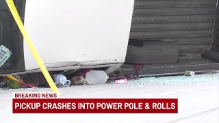 Pickup crashes into power pole and rolls