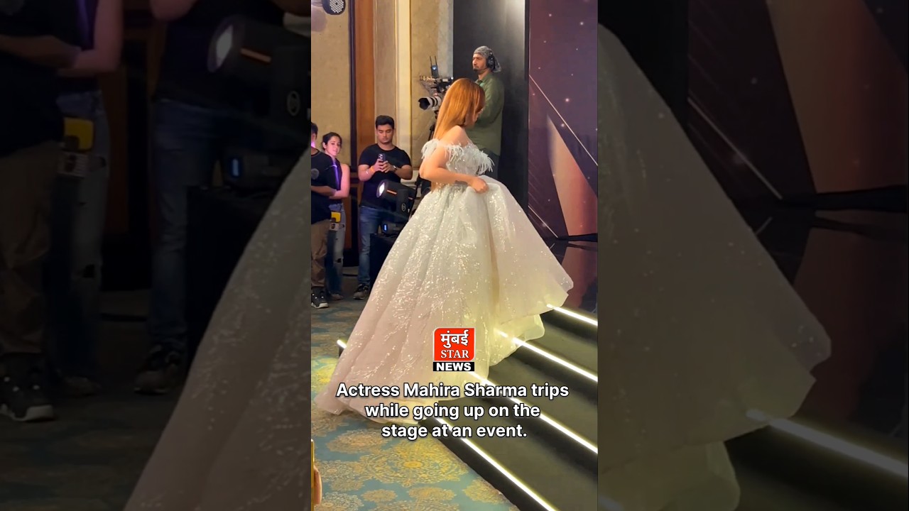 Actress Mahira Sharma trips while going up on the stage at an event. 