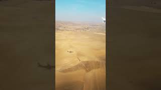 Window-View-Of-A-Plane-Landing-At-Esenboga-Airport