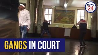 WATCH: Police draw arms as rival gang members clash in Joburg court screenshot 2