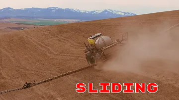 How do tractors spray steep farmland in America?