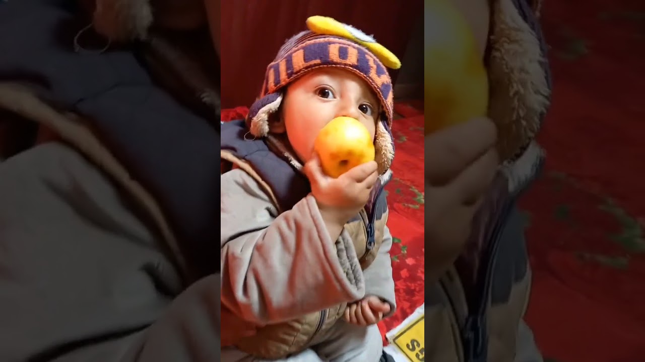 Cute baby eating apple 