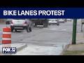 Small business owners protest Archer Avenue bike lanes