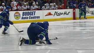 Boeser crawls & scrambles to bench after blocking hard shot with foot