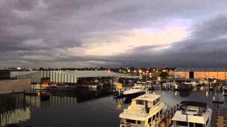 Storm clouds rolling over St. Petersburg and Tampa Bay from sunset to dusk to night