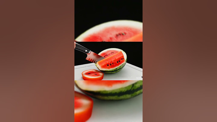 "Slicing perfection: a crystal-clear glass watermelon under the blade, glowing in summer sunlight."