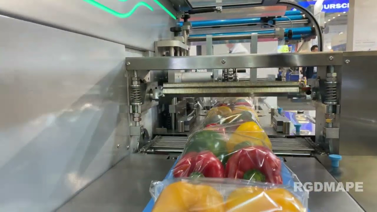 MÁQUINA EMPAQUETADORA FLOW-PACK PARA ENVASADO DE MANDARINAS Y PIMIENTOS. RGDMAPE,S.L.