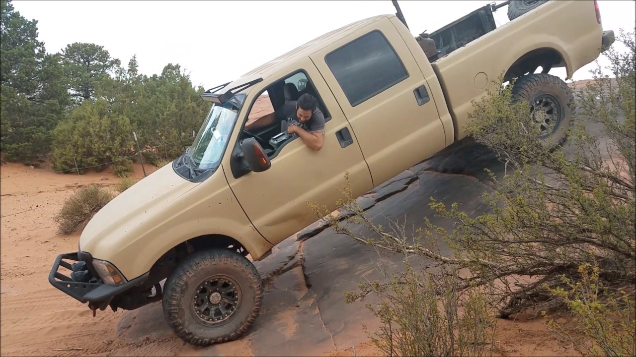 4 door rock crawling powerstroke in Moab on Fins & Things.