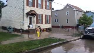 Residents start to clean up after flooding in Middletown