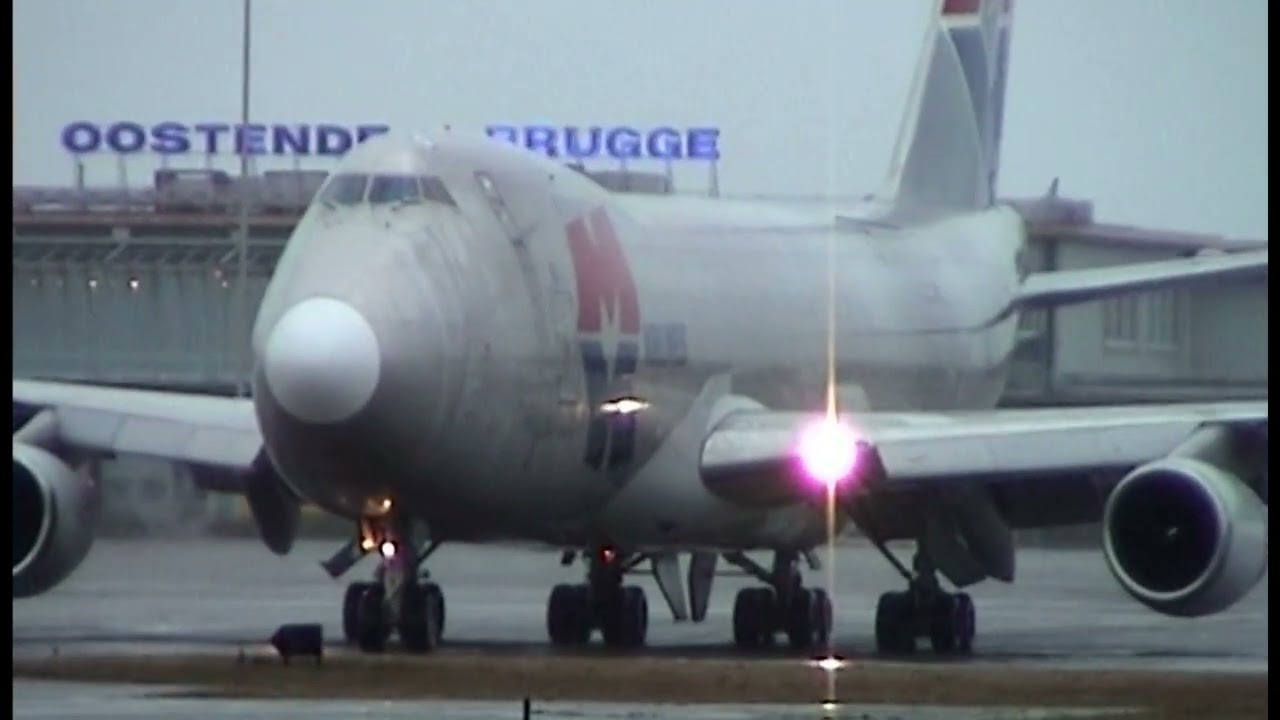 HEAVY RAIN  movements , AN12 / MD11F / 747 ( 9G-MKL & 9G-MKQ ) EBOS 2004