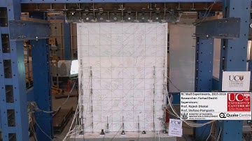 Evolution of out-of-plane deformation and subsequent instability in a wall specimen