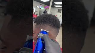 Mid bald fade with curls and sideburns haircut by choochcutz
