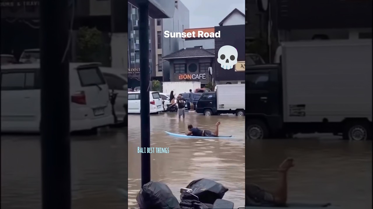 Local Bali Resident Surfs During Flood – Unique Bali Moment