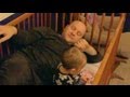 Dad climbs into crib