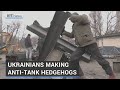 Ukrainian builders making 'hedgehogs' to thwart tanks