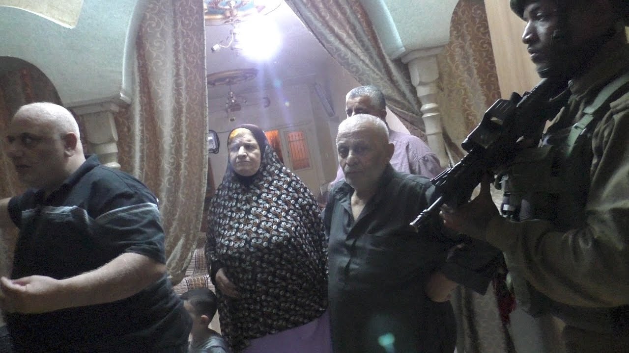 Israeli soldiers arrest 'Udai Da'na, 17, at home in Hebron 'Eid al-Adha, 23 Aug. 2018