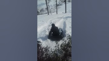 Kassi sledding in the bag and pool tire float