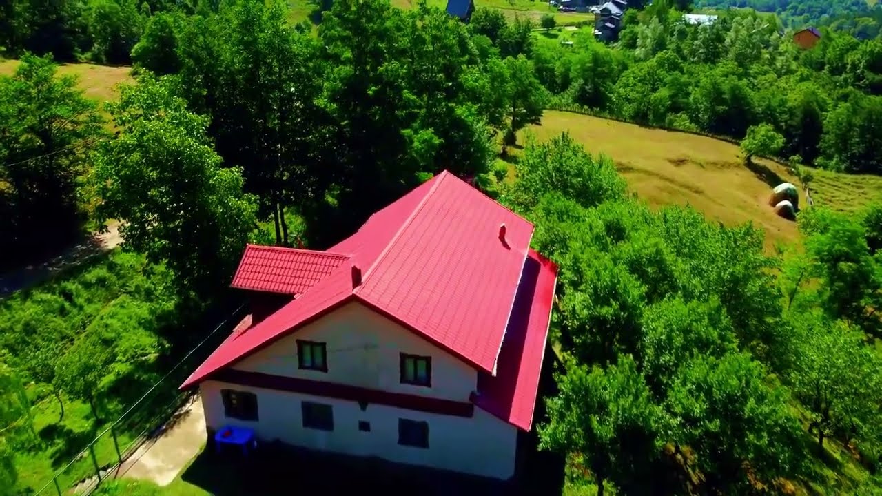 A drone bird's eye view of tranquillity: Brunhill Park Rochester and a secluded wild mountain cabin