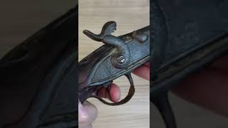 a percussion pistol with a faulty lock mechanism