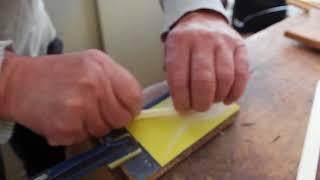 How to adjust the bridge bone saddle height on a guitar