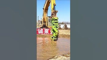 The image shows an excavator (a Sumitomo machine) with a specialized attachment mounted