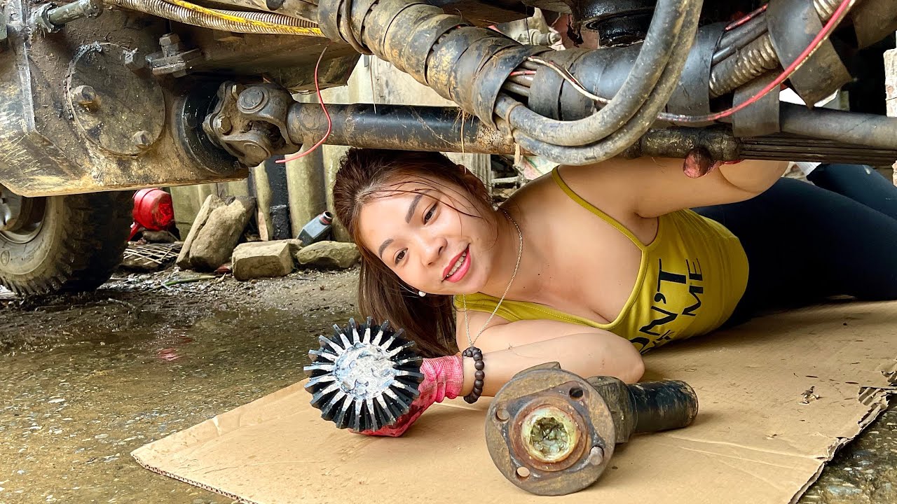 The challenge for the female mechanic: repair a broken welded sun sculpture.