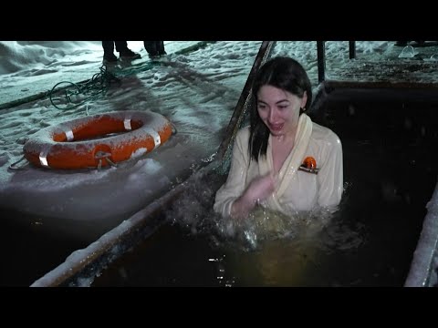 An ice cold dip for Russians marking Jesus's baptism on Epiphany | AFP