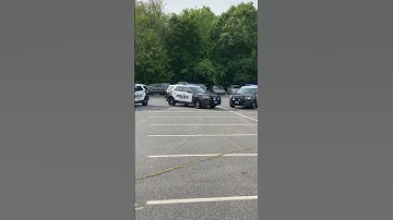National Night Out. Police Ford Interceptors on Display. Lights Flashing.